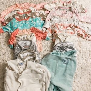 Lot of newborn footed sleepers and swaddles